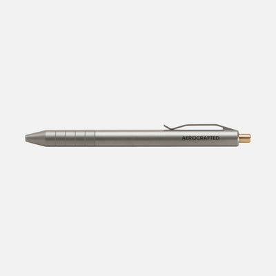 Retract click pen is a titanium pen with a bronze clicker and integral pocket clip machined by aerospace engineers in California and ships world wide #material_titanium-bronze