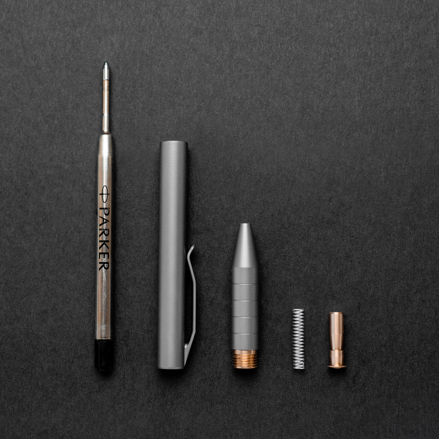 Titanium click pen is simple and easy to assemble designed with one moving bronze part and holds a parker refill ink cartridge is one of the smallest titanium pens on the market #material_titanium-bronze
