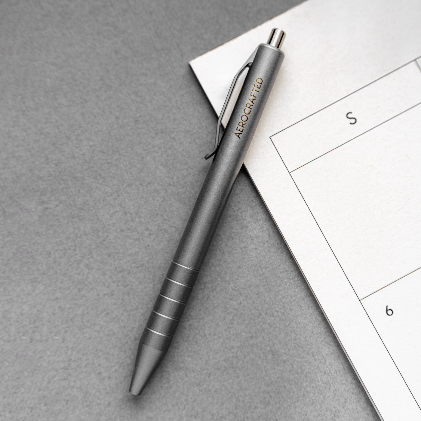 The stainless steel and titanium edc pen made as a new option for the retract click pen designed and machined in the usa #material_titanium-stainless