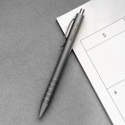 The stainless steel and titanium edc pen made as a new option for the retract click pen designed and machined in the usa #material_titanium-stainless