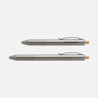Two views of the titanium retract click pens to see size difference of the two titanium pens