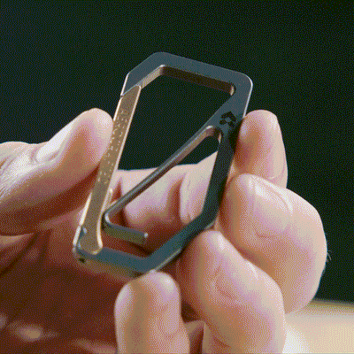 the uplock edc carabiner is a titanium keychain carabiner and showing it open and closing with it's unique design crafted by aerospace engineers at Aerocrafted in California all made in the usa #material_titanium-bronze