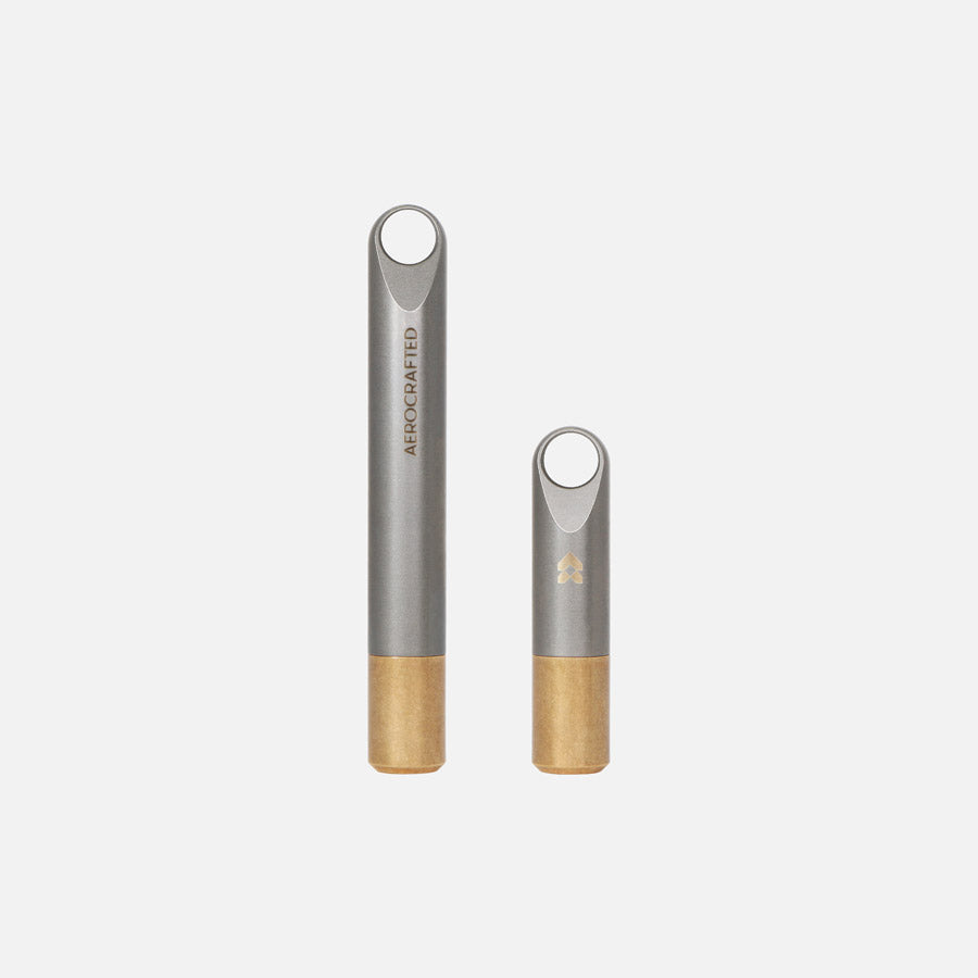 fairing edc stash cash is a minimalist keychain made out of titanium and bronze and can act as a pill keychain or a cash stash keychain made in the usa by Aerospace Engineers at Aerocrafted in California