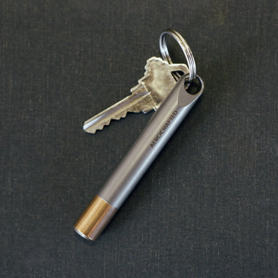 edc titanium stash on minimalist keyring called the fairing keychain stash can house cash or pills and made in california #material_titanium-bronze